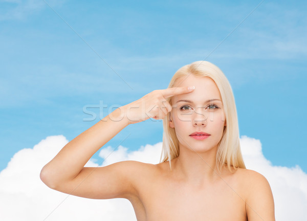 Piękna kobieta dotknąć czoło zdrowia piękna twarz Zdjęcia stock © dolgachov