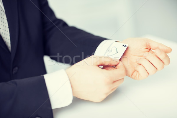 mans hand hiding ace in the sleeve Stock photo © dolgachov