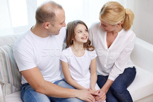 happy parents with little daughter at home Stock photo © dolgachov