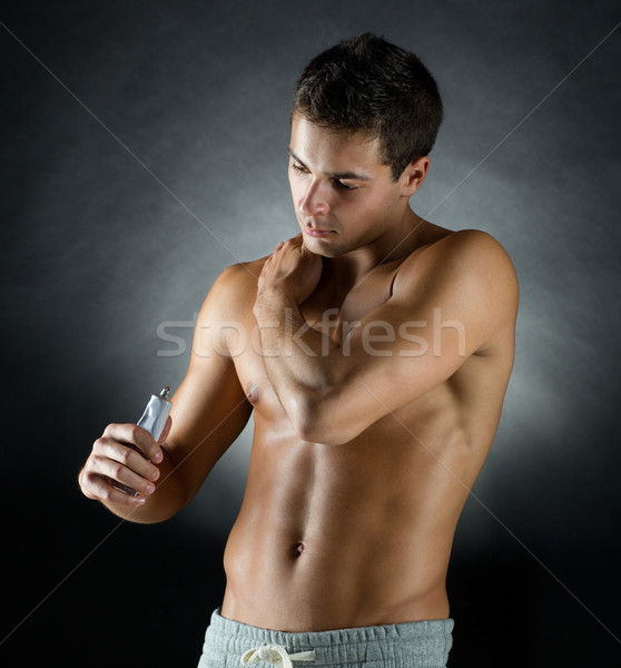 Jungen männlich Bodybuilder Schmerzen Erleichterung Stock foto © dolgachov