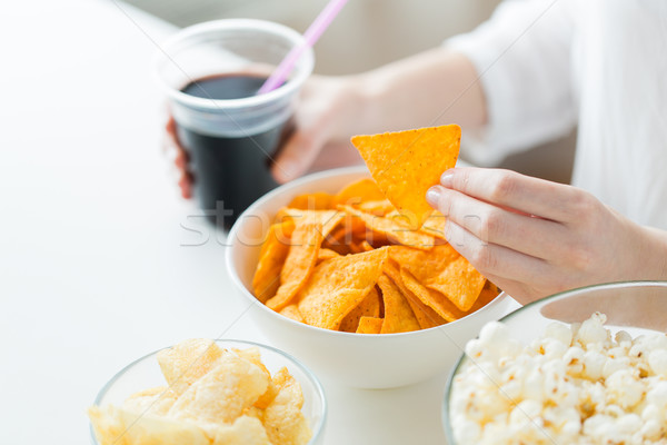 close up of woman with junk food and coca cola cup Stock photo © dolgachov