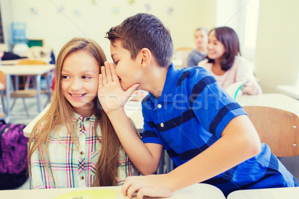 Souriant écolier chuchotement compagne oreille éducation [[stock_photo]] © dolgachov