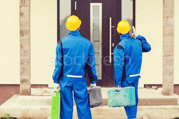 Grupy budowniczych działalności budynku zespołowej ludzi Zdjęcia stock © dolgachov