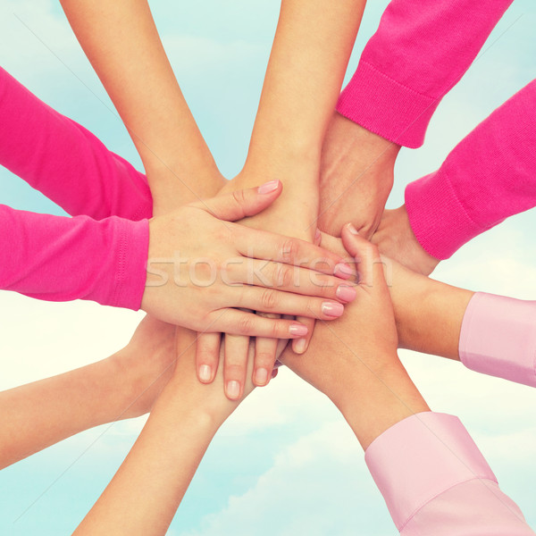 close up of women with hands on top Stock photo © dolgachov