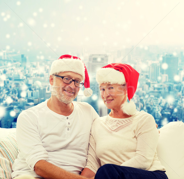 happy senior couple in santa helper hats Stock photo © dolgachov