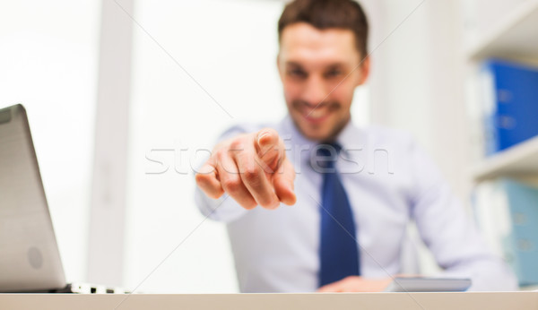 smiling businessman pointing on you in office Stock photo © dolgachov