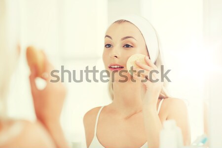 Stock photo: smiling young woman or teen girl sending blow kiss