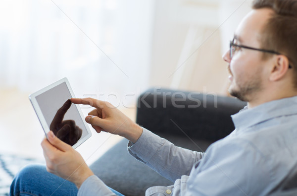 man with tablet pc at home Stock photo © dolgachov