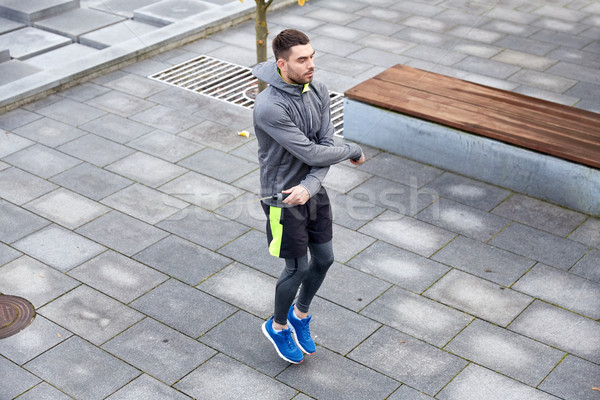man exercising with jump-rope outdoors Stock photo © dolgachov