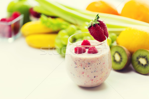 close up of glass with milk shake and fruits Stock photo © dolgachov