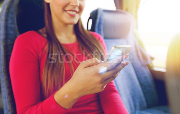 close up of woman in travel bus with smartphone Stock photo © dolgachov
