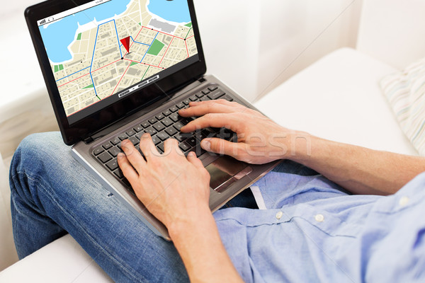 close up of man typing on laptop computer at home Stock photo © dolgachov