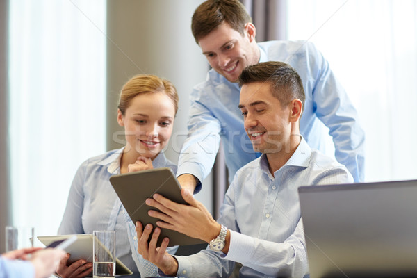 smiling business people meeting in office Stock photo © dolgachov