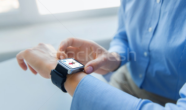 close up of hands with fitness app on smart watch Stock photo © dolgachov