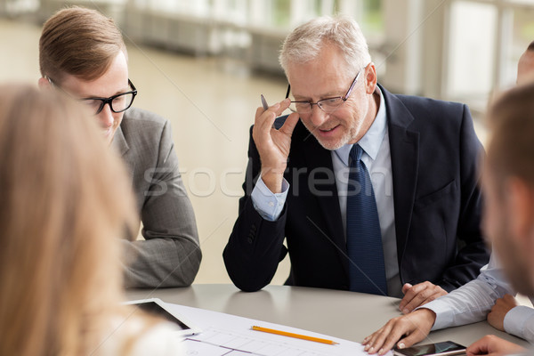 architects with tablet pc and blueprint at office Stock photo © dolgachov