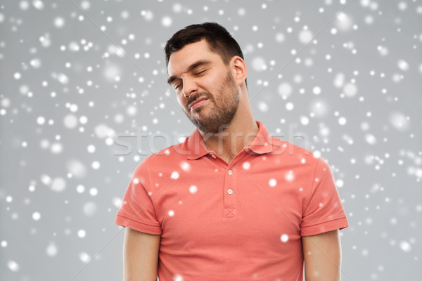 man wrying over snow background Stock photo © dolgachov
