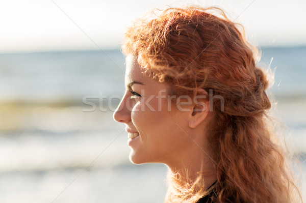 happy young redhead woman face on beach Stock photo © dolgachov