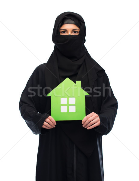 muslim woman in hijab with green house over white Stock photo © dolgachov