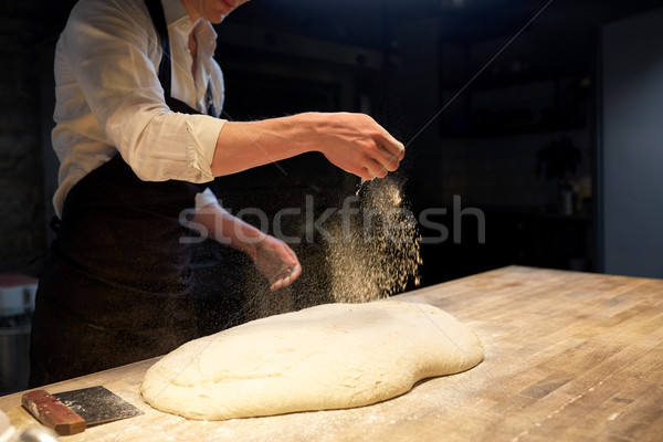 chef or baker making bread dough at bakery Stock photo © dolgachov