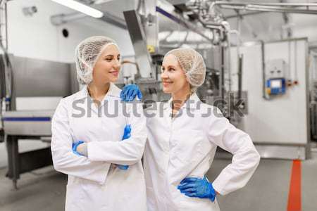 women technologists at ice cream factory Stock photo © dolgachov