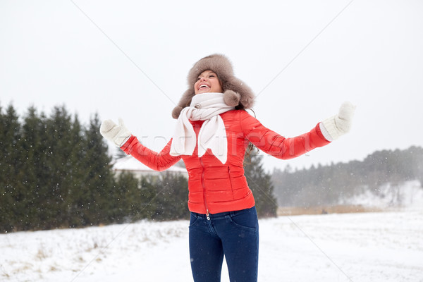 happy woman in winter fur hat having fun outdoors Stock photo © dolgachov