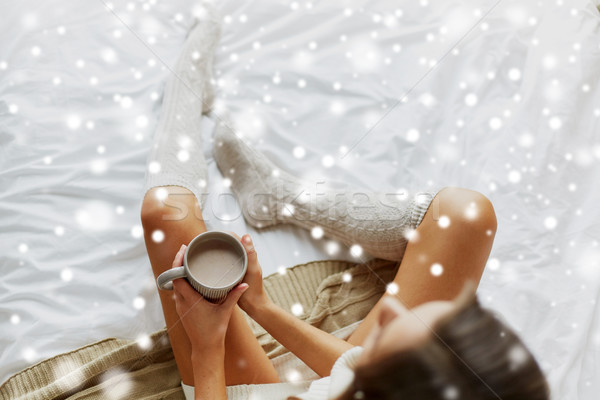 close up of woman with cocoa cup in bed at home Stock photo © dolgachov