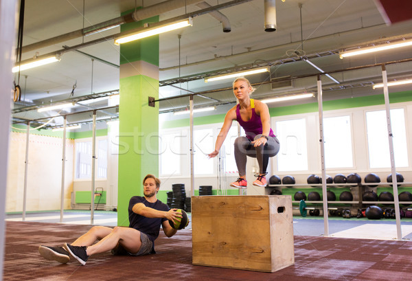 woman and man with medicine ball exercising in gym Stock photo © dolgachov