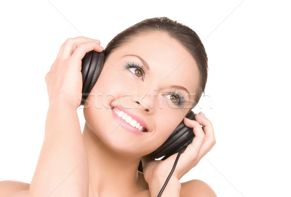 Feliz mujer auriculares Foto blanco cara Foto stock © dolgachov
