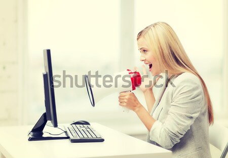 strict businesswoman shouting in megaphone Stock photo © dolgachov