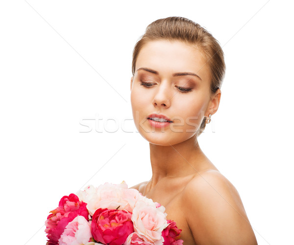 Femme boucles d'oreilles fleurs beauté Photo stock © dolgachov