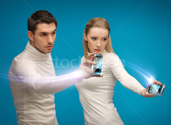 Futuristische man vrouw werken gadgets toekomst Stockfoto © dolgachov