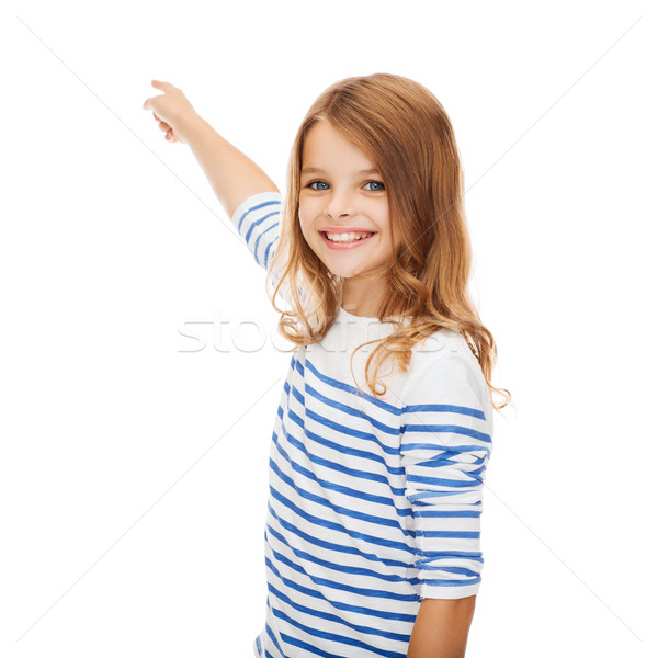 smiling girl pointing at virtual screen Stock photo © dolgachov