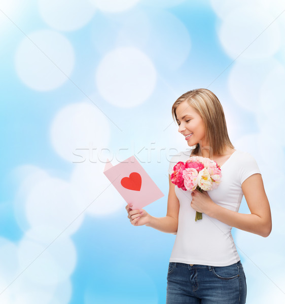 smiling girl with postcard and bouquet of flowers Stock photo © dolgachov