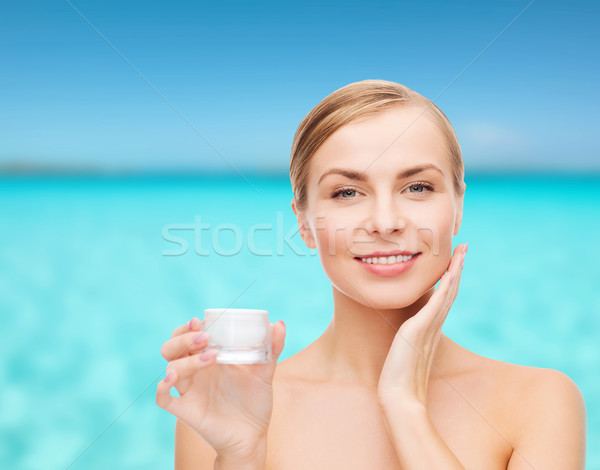 woman applying cream on her skin Stock photo © dolgachov