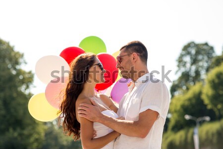 smiling couple in city Stock photo © dolgachov