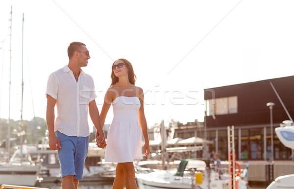 smiling couple in city Stock photo © dolgachov