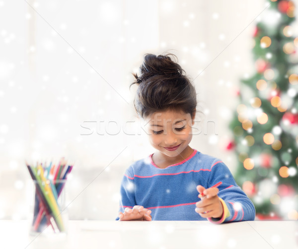smiling little girl with pencils drawing at home Stock photo © dolgachov