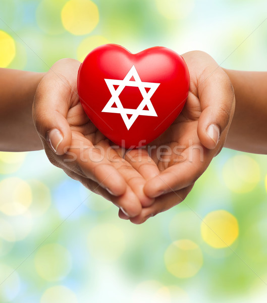 Közelkép kezek tart szív csillag vallás Stock fotó © dolgachov