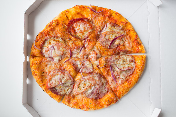 close up of pizza in paper box on table Stock photo © dolgachov