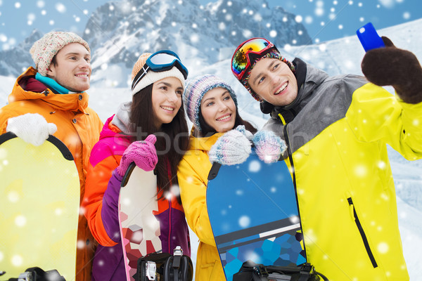 Heureux amis smartphone sports d'hiver loisirs amitié [[stock_photo]] © dolgachov