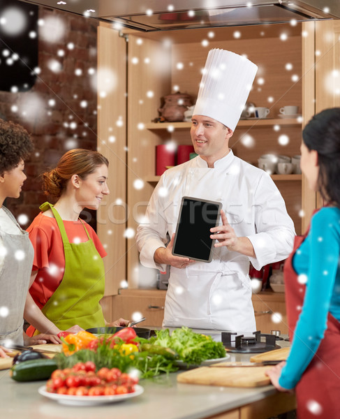 happy women with chef and tablet pc in kitchen Stock photo © dolgachov