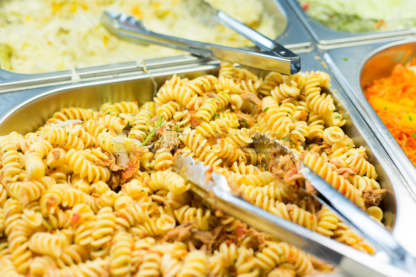 close up of pasta and dishes on catering tray Stock photo © dolgachov