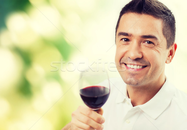happy man drinking red wine from glass Stock photo © dolgachov
