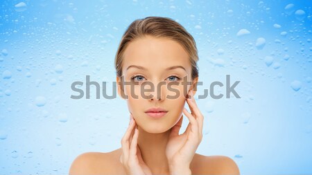 smiling young woman face and shoulders Stock photo © dolgachov