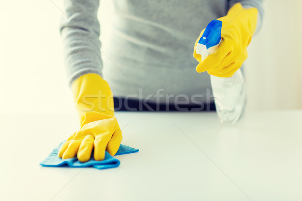 close up of woman cleaning table with cloth Stock photo © dolgachov