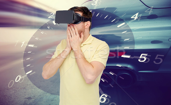 man in virtual reality headset and car racing game Stock photo © dolgachov