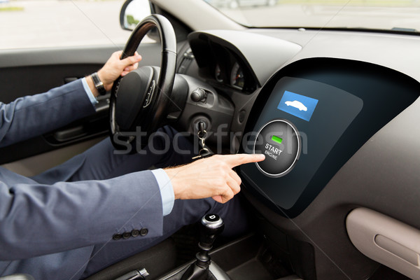 close up of man in car with starter on computer Stock photo © dolgachov