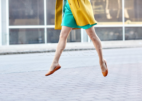 young woman or teenage girl legs on city street Stock photo © dolgachov