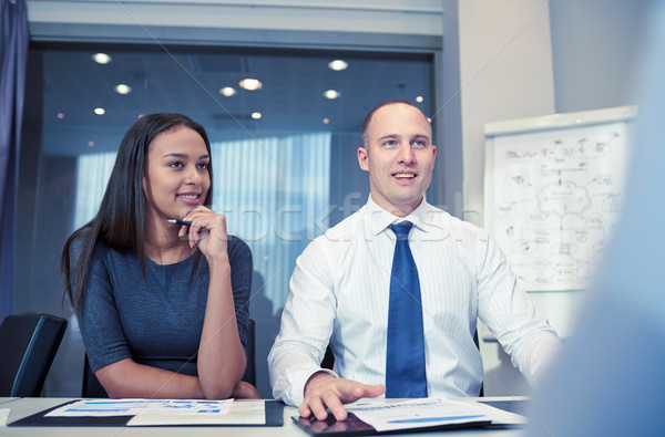 smiling business people meeting in office Stock photo © dolgachov