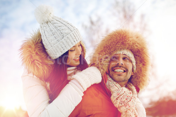 happy couple having fun over winter background Stock photo © dolgachov